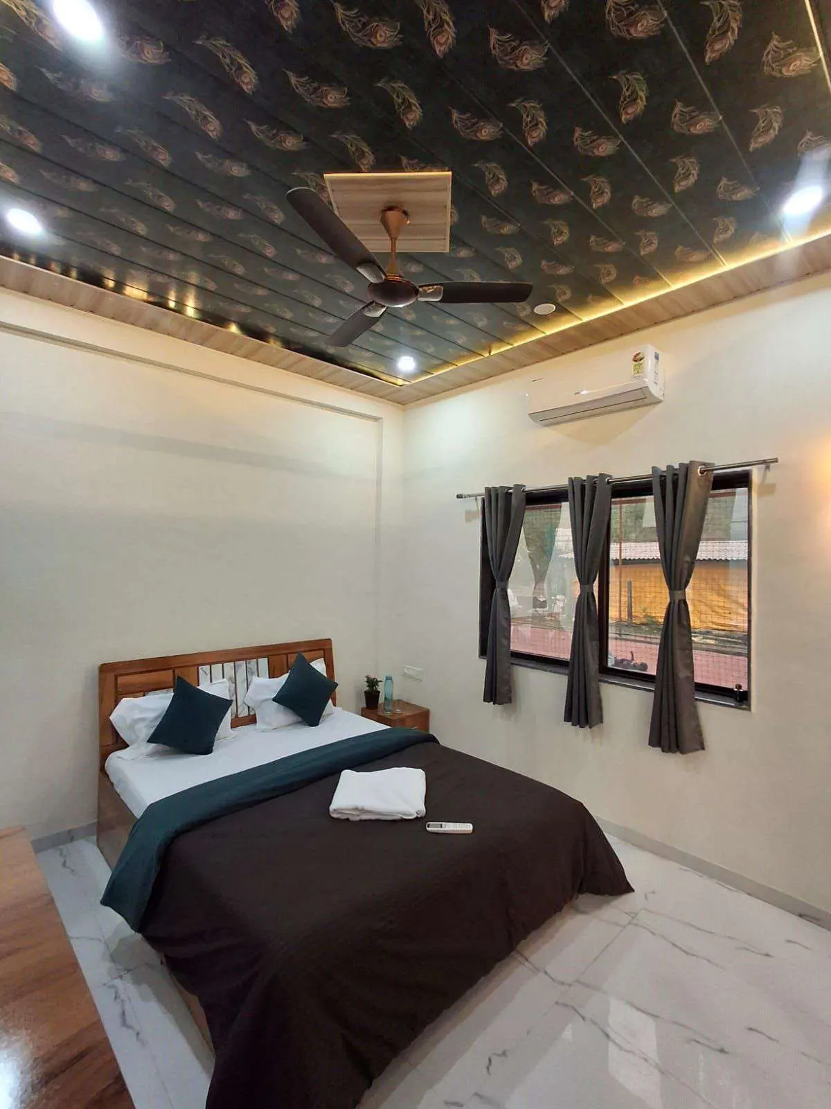 Air-conditioned bedroom in Shuubh Aavishkar 2BHK Villa, a 2 BHK villa in Lonavala on rent