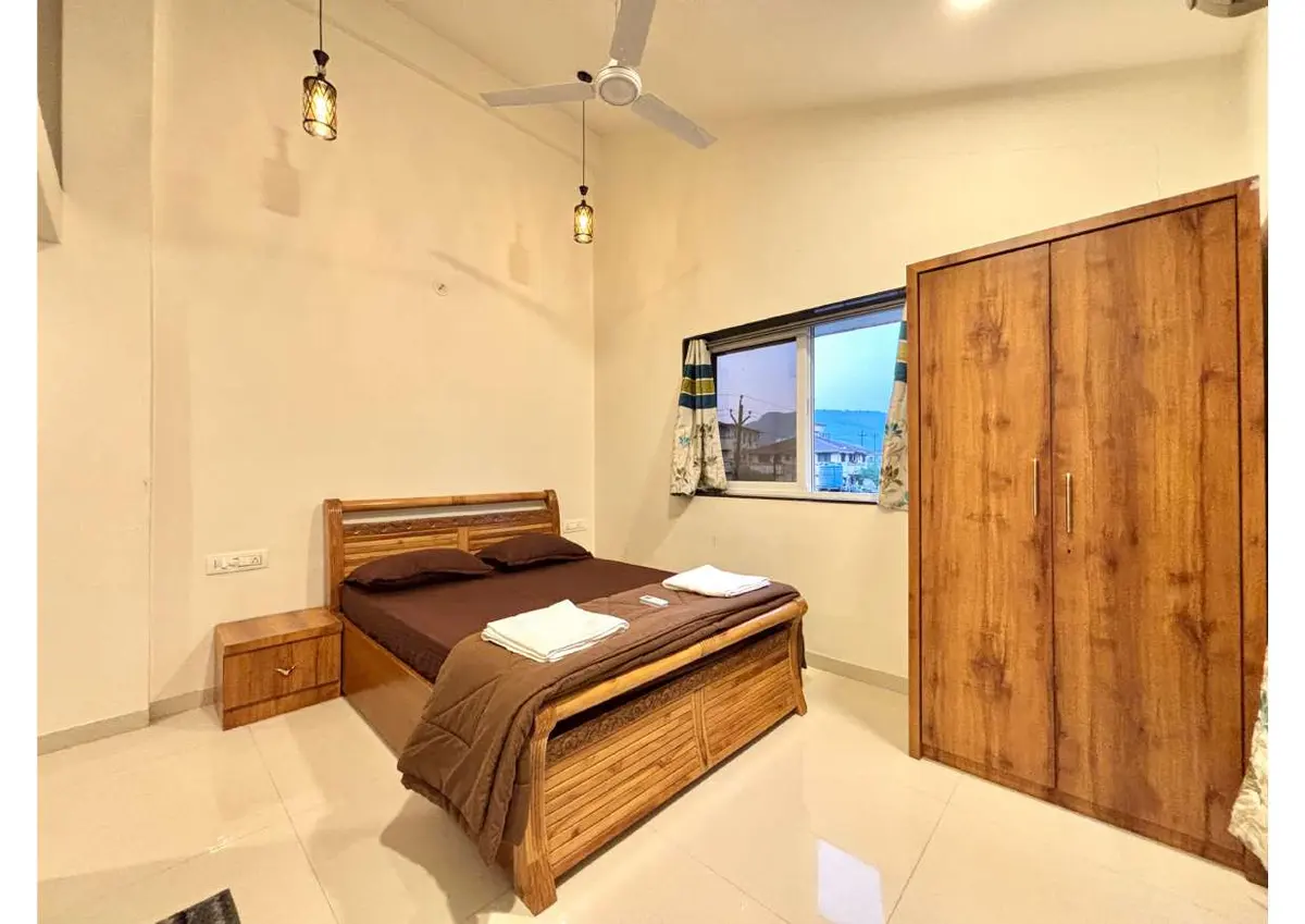 Air-conditioned bedroom in Duke's Nose Villa, a 4 BHK villa in Lonavala on rent