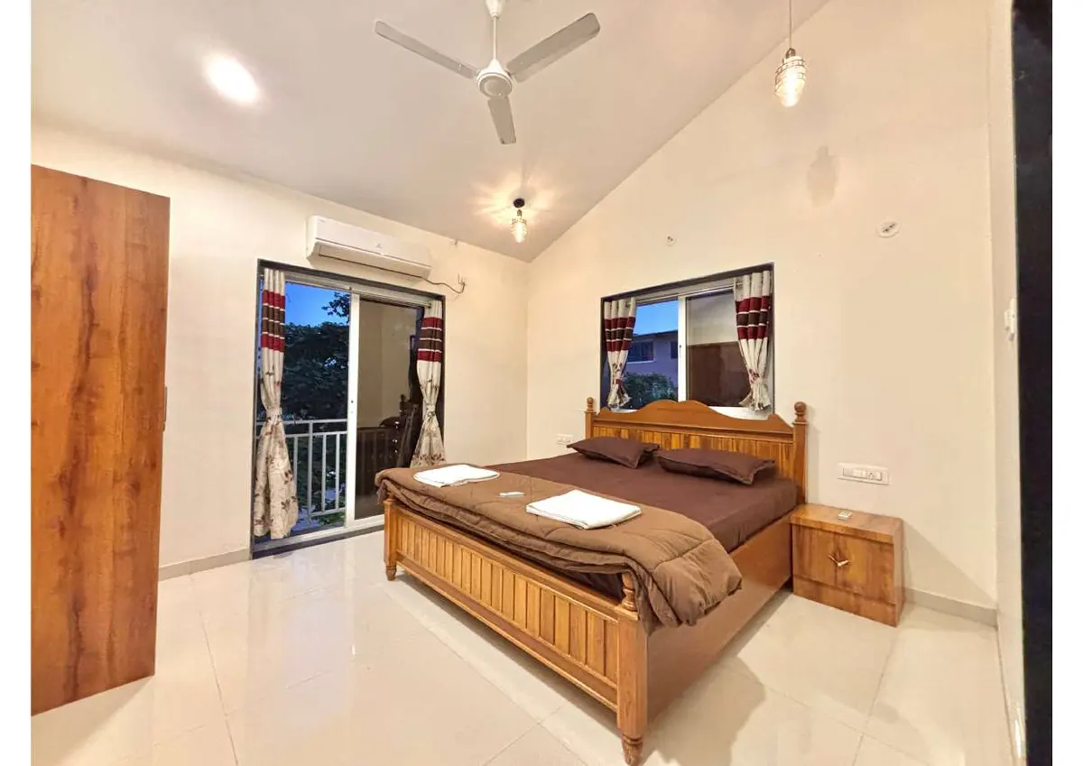 Air-conditioned bedroom in Duke's Nose Villa, a 4 BHK villa in Lonavala on rent