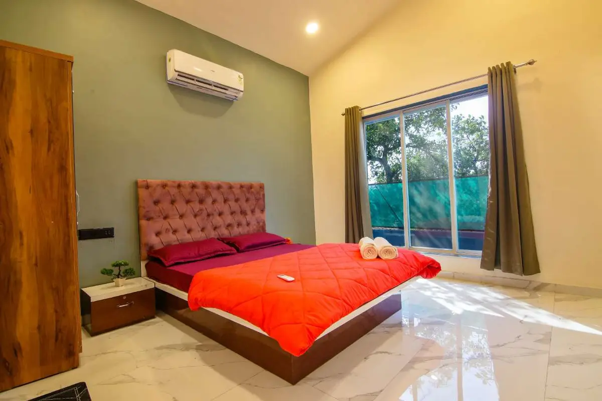 Air-conditioned bedroom in Shuubh Hillside 4BHK Villa, a 4 BHK villa in Lonavala on rent