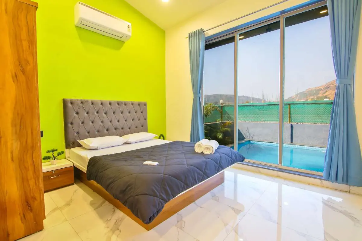 Air-conditioned bedroom in Shuubh Hillside 4BHK Villa, a 4 BHK villa in Lonavala on rent