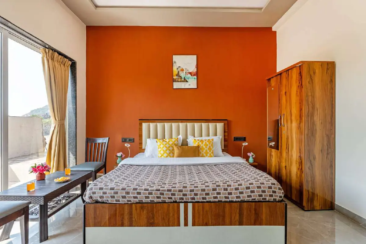 Air-conditioned bedroom in Shuubh Kaustubh 5BHK Villa, a 5 BHK villa in Lonavala on rent