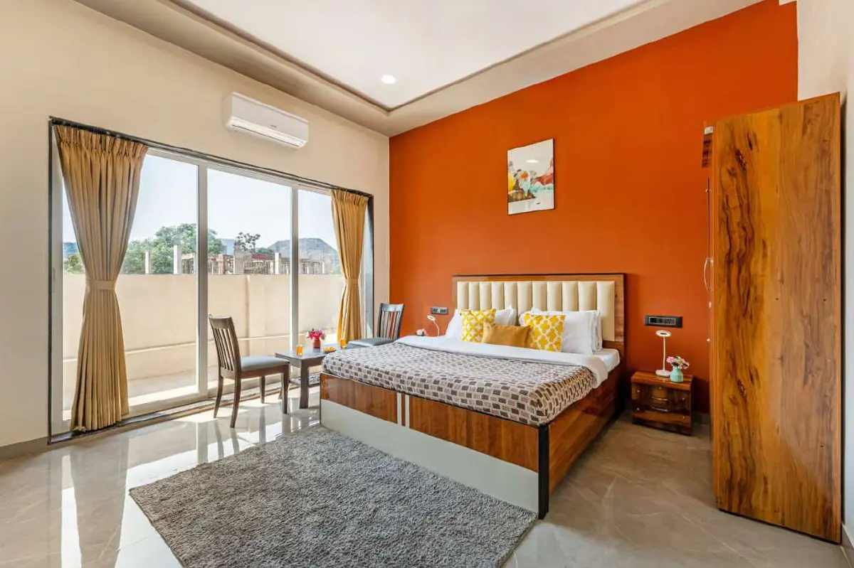 Air-conditioned bedroom in Shuubh Kaustubh 5BHK Villa, a 5 BHK villa in Lonavala on rent