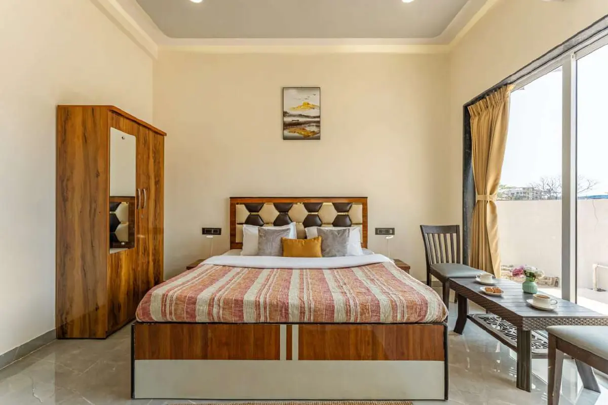 Air-conditioned bedroom in Shuubh Kaustubh 5BHK Villa, a 5 BHK villa in Lonavala on rent
