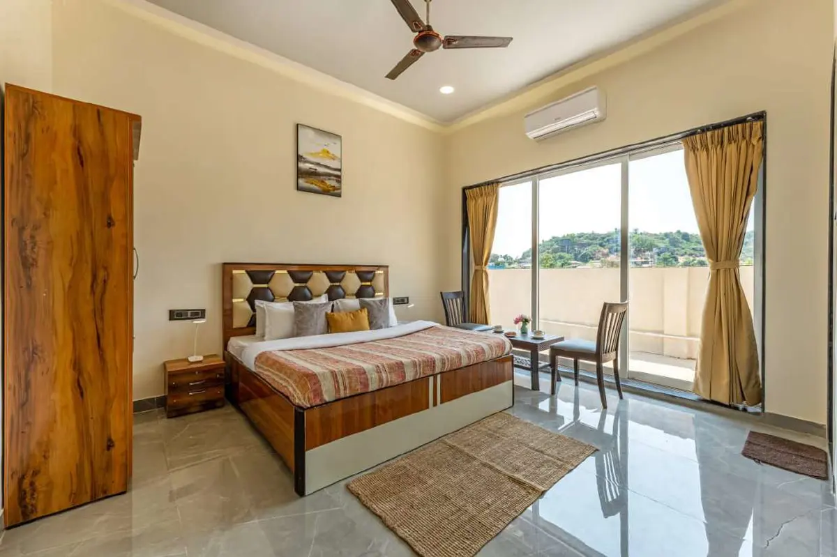 Air-conditioned bedroom in Shuubh Kaustubh 5BHK Villa, a 5 BHK villa in Lonavala on rent