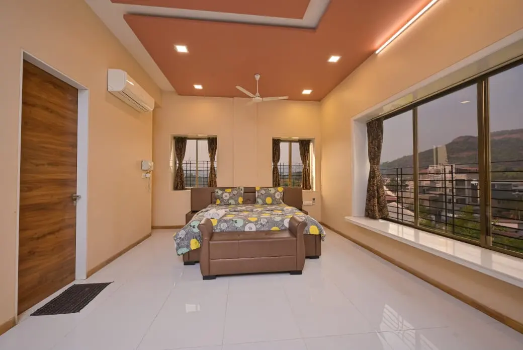Air-conditioned bedroom in Shuubh Mountain Amber 5BHK Villa, a 5 BHK villa in Lonavala on rent