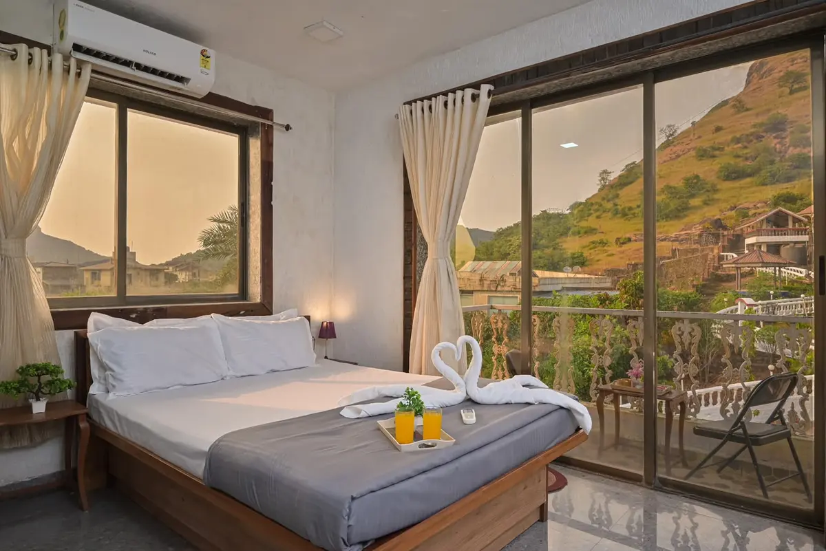 Air-conditioned bedroom in Shuubh Mountain Nest 6BHK Villa, a 6 BHK villa in Lonavala on rent