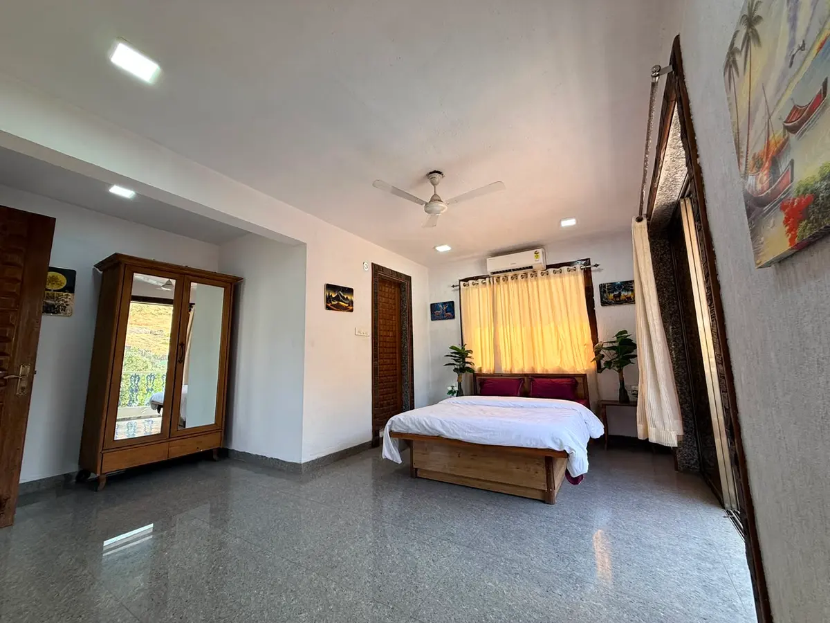 Air-conditioned bedroom in Shuubh Mountain Nest 6BHK Villa, a 6 BHK villa in Lonavala on rent