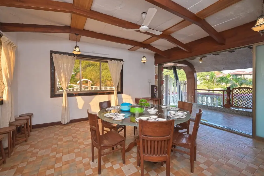 Outdoor dining table laid out at Shuubh Mountain Nest 6BHK Villa