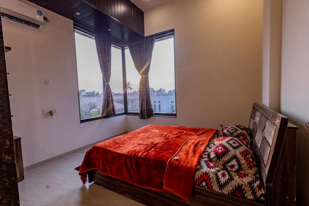 Air-conditioned bedroom in Rose Villa, a 4 BHK villa in Lonavala on rent