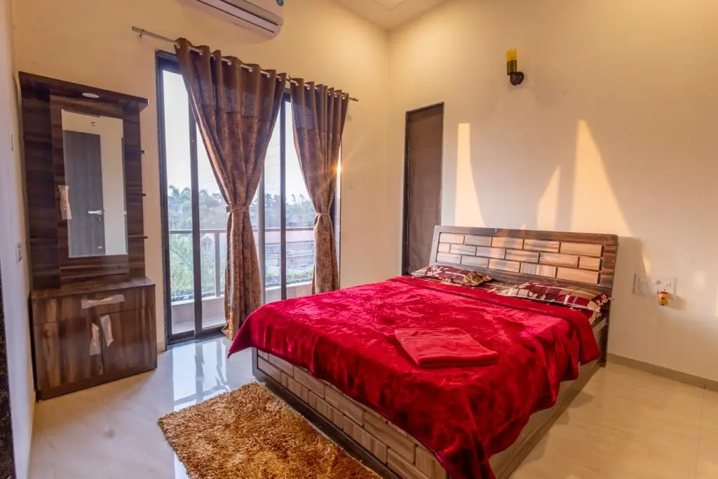 Air-conditioned bedroom in Rose Villa, a 4 BHK villa in Lonavala on rent