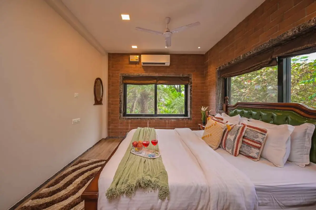 Air-conditioned bedroom in Shuubh Staycation 3BHK Villa, a 3 BHK villa in Lonavala on rent