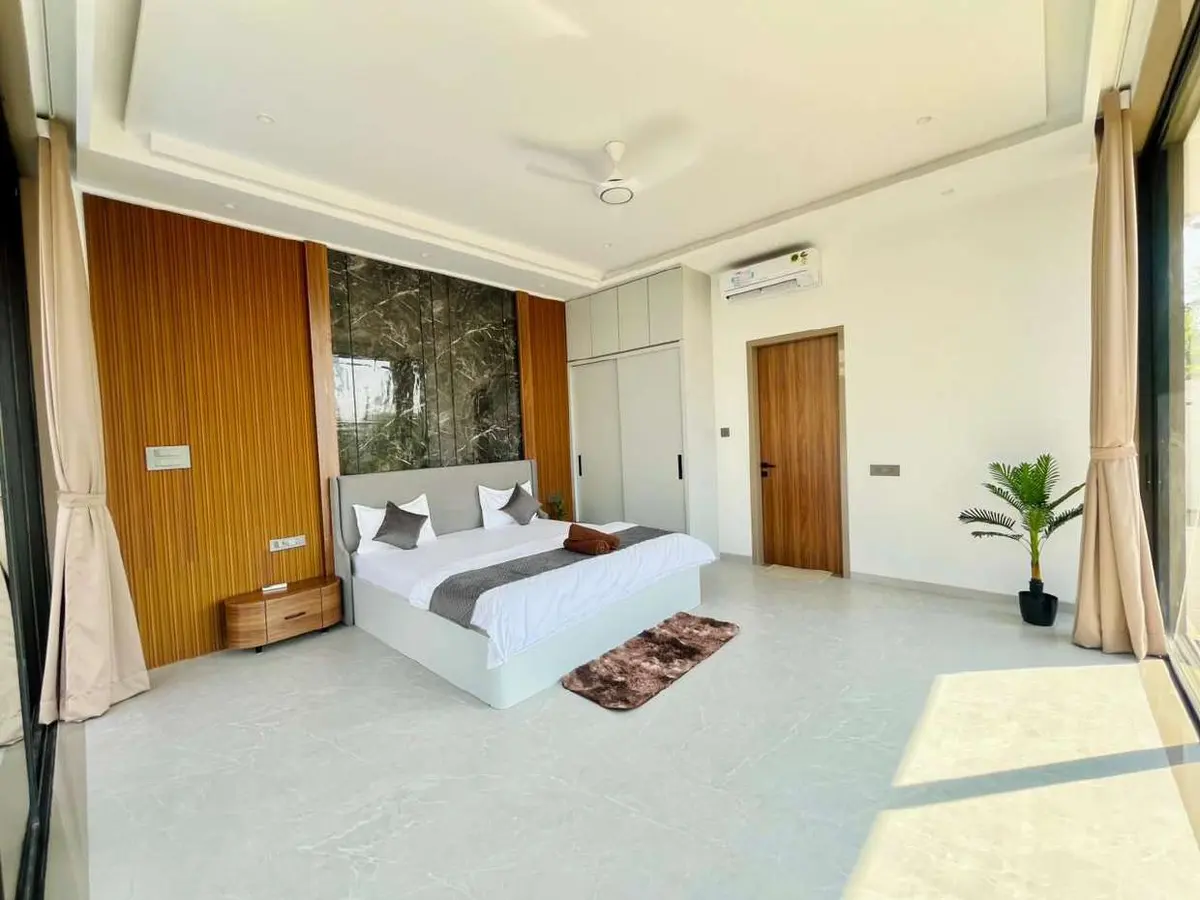 Air-conditioned bedroom in Vantara Villa, a 4 BHK villa in Lonavala on rent