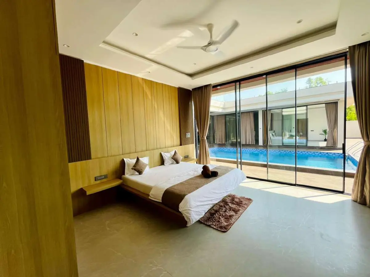 Air-conditioned bedroom in Vantara Villa, a 4 BHK villa in Lonavala on rent