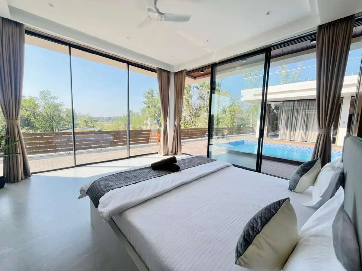 Air-conditioned bedroom in Vantara Villa, a 4 BHK villa in Lonavala on rent