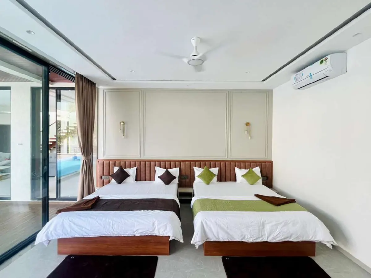 Air-conditioned bedroom in Vantara Villa, a 4 BHK villa in Lonavala on rent