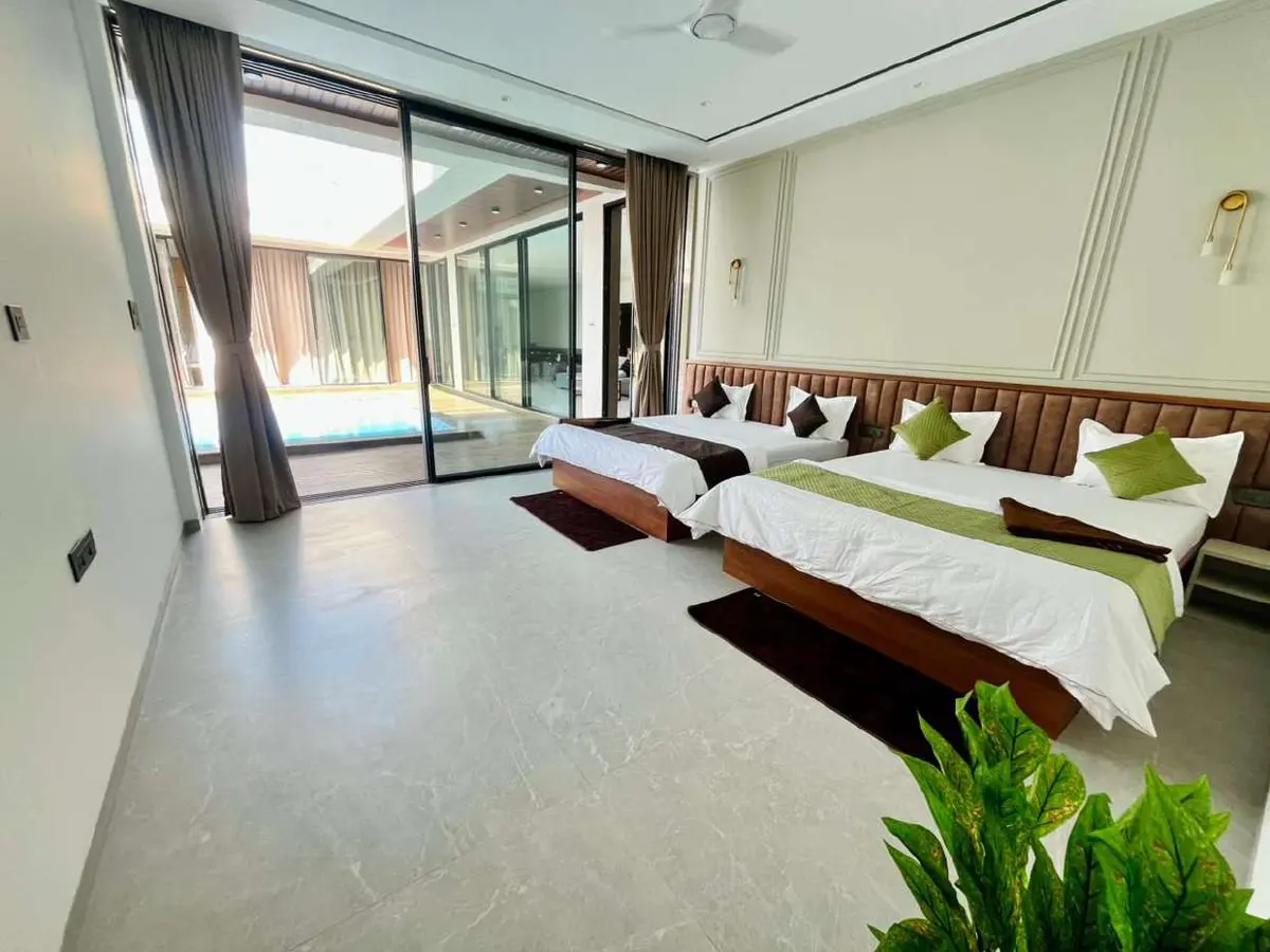 Air-conditioned bedroom in Vantara Villa, a 4 BHK villa in Lonavala on rent