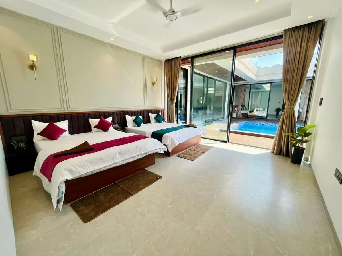 Air-conditioned bedroom in Vantara Villa, a 4 BHK villa in Lonavala on rent